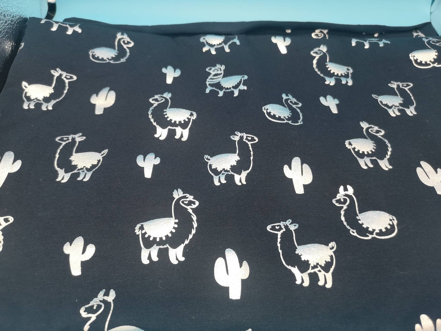 Jersey: navy silver foil llamas and cacti, aqua striped flamingos, blue palm trees, pandas, flamingos and pineapples