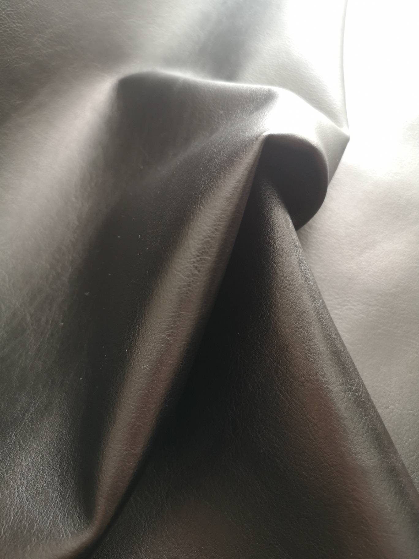 PVC leather: black and red. Soft leatherette, leathercloth