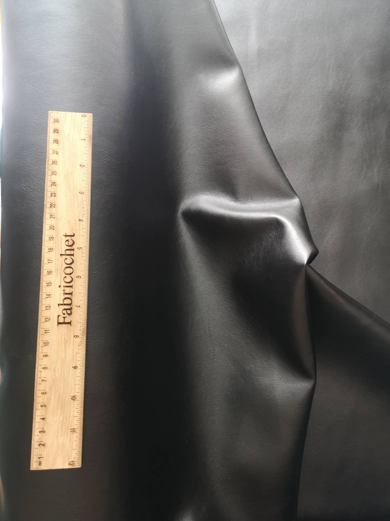 PVC leather: black and red. Soft leatherette, leathercloth